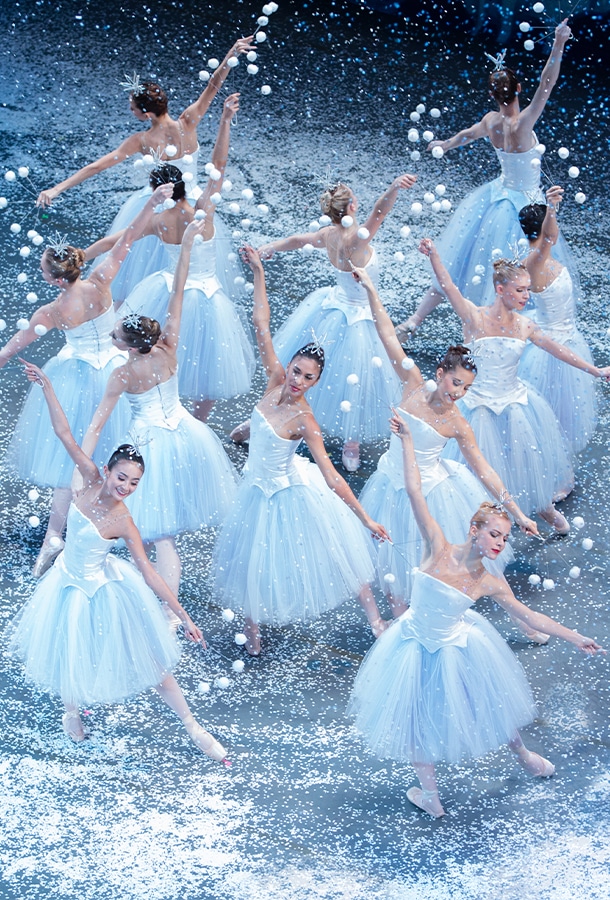 ballerinas in white dresses dancing in the snow