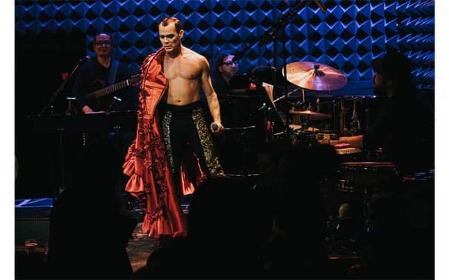 Migguel Anggelo on stage shirtless