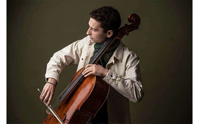 Oliver Herbert posing with cello