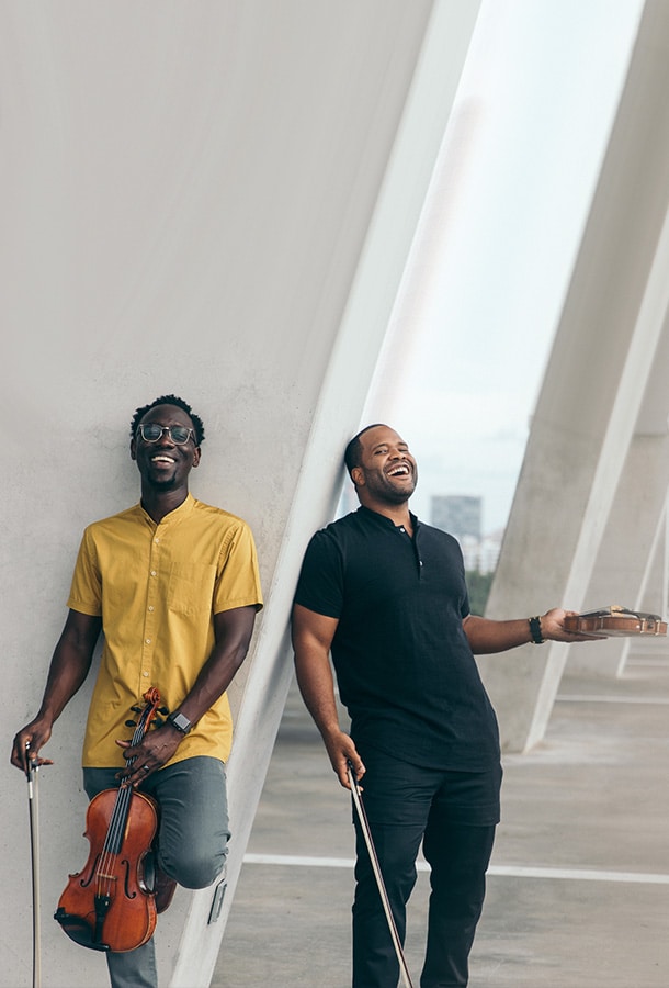 Black Violin: Give Thanks Tour featured Will B. and Kev Marcus posing, holding violins