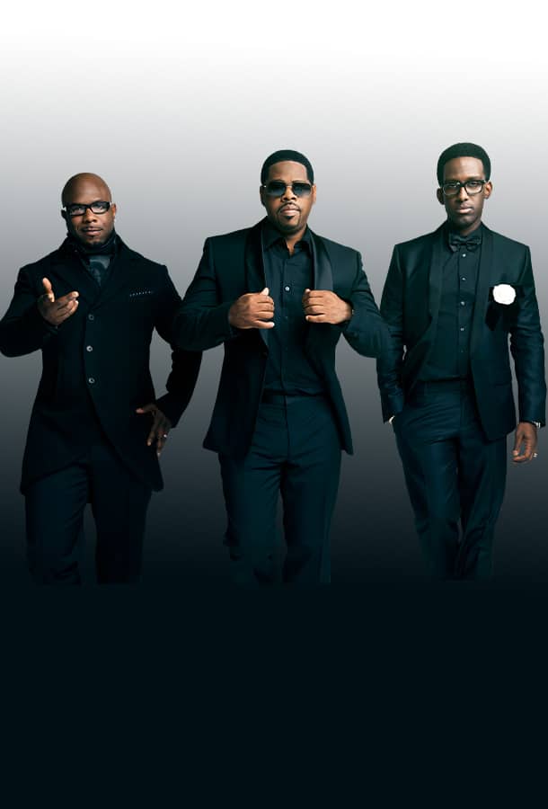 Boyz II Men featuring Wanya Morris, Nathan Morris, Shawn Stockman posing in black tux