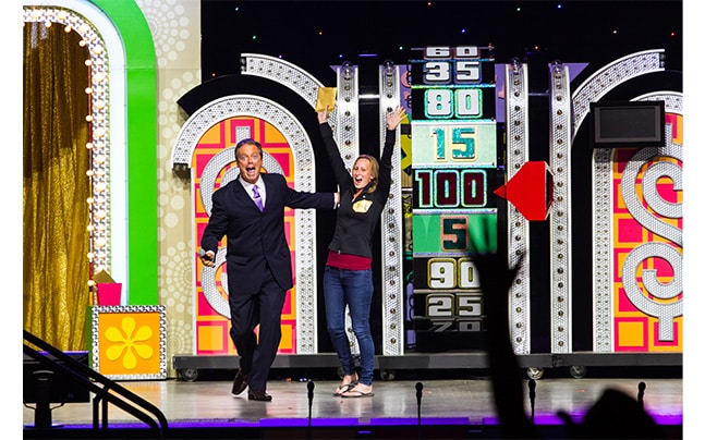 Price is Right wheel game and jumping contestant.