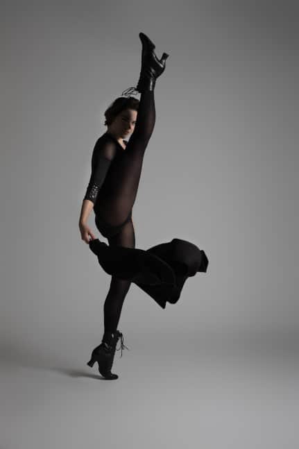 girl dances with outstretched leg