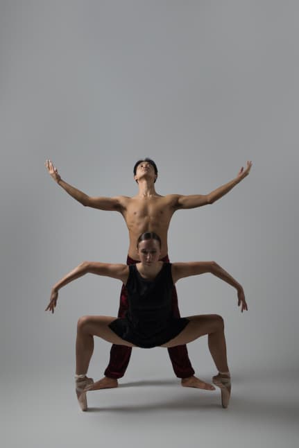 male and female in outstretched arms dance pose