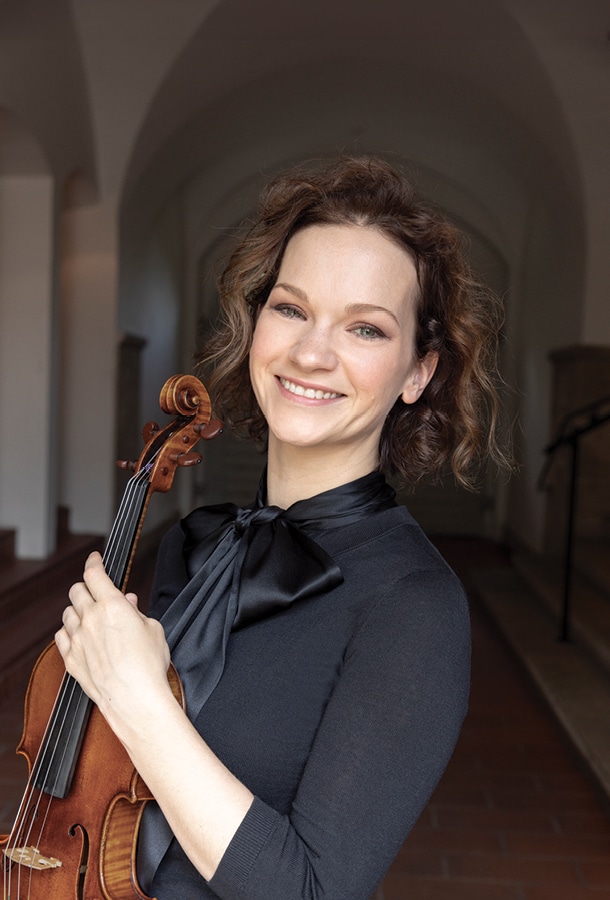 Hilary Hahn headshot with violin