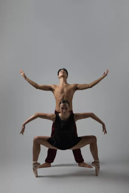 students in outstretched dance pose