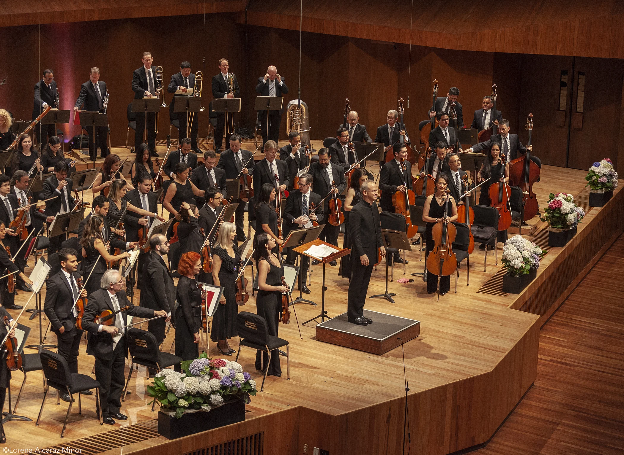 Carlos Miguel Prieto take a bow with the orchestra.