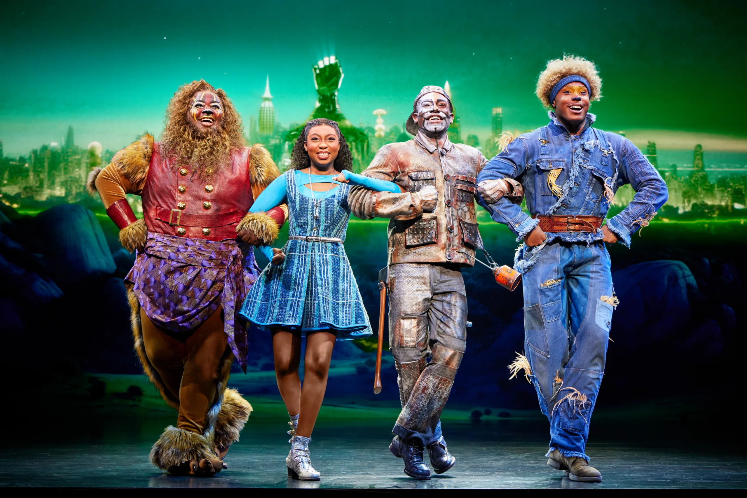 Kyle Ramar Freeman as Lion, Nichelle Lewis as Dorothy, Phillip Johnson Richardson as Tinman, Avery Wilson as Scarecrow.