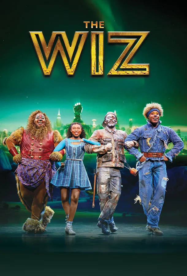 (from left to right) The Lion, Dorothy, the Tin Man and the Scarecrow with gold "The Wiz" logo above over an emerald green background.