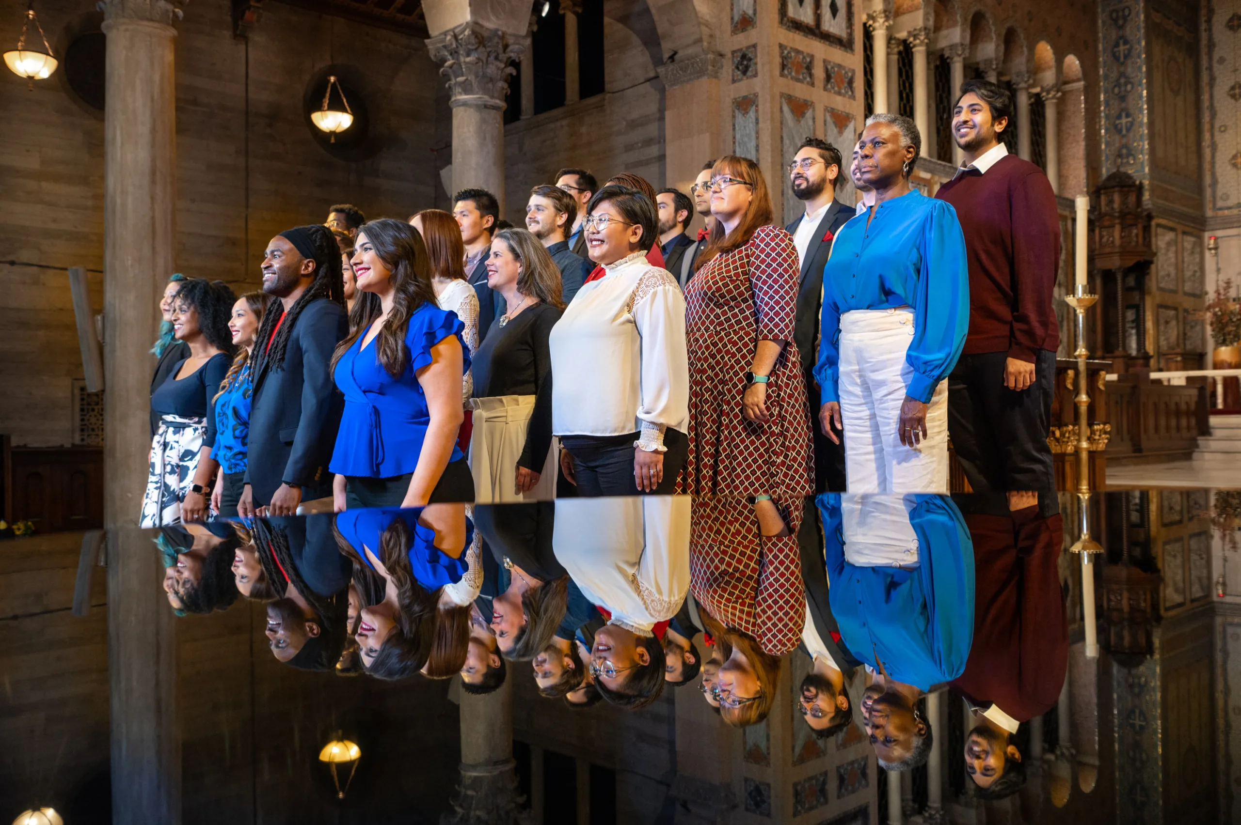 Tonality choir standing rehearsing in St. John's Episcopal Cathedral.