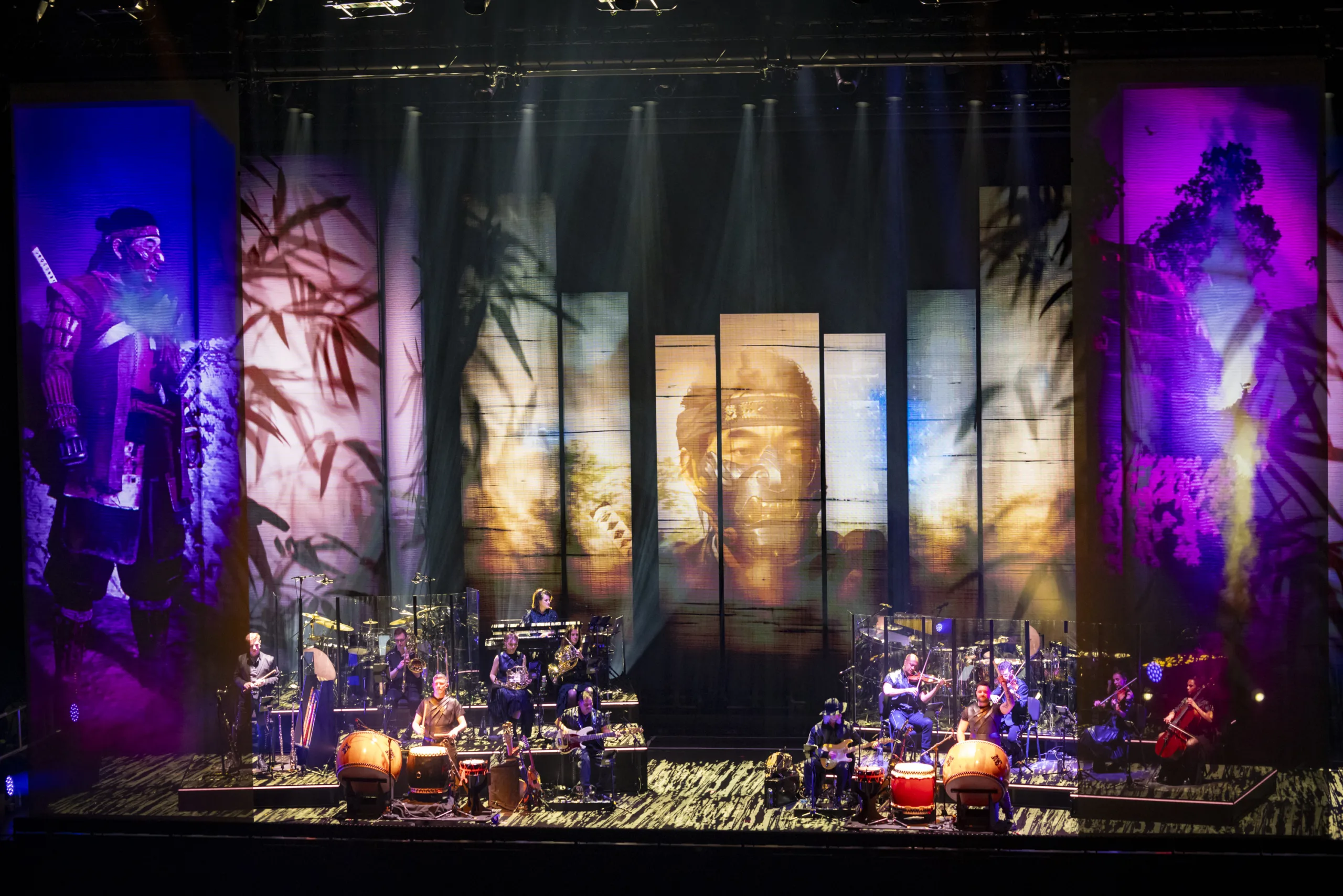 The band on stage surrounded by projections from 