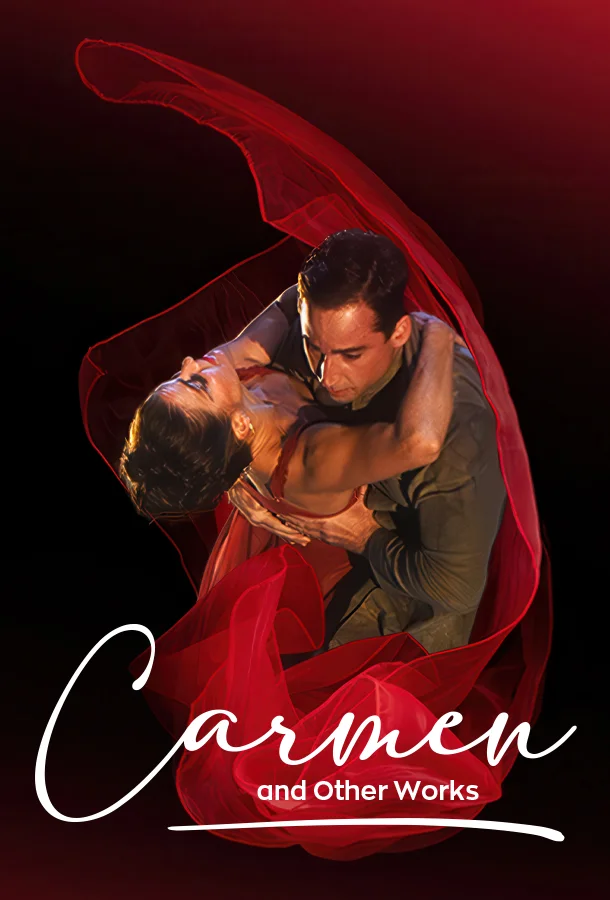 Dancers in an embrace with a swirling red skirt all around them.