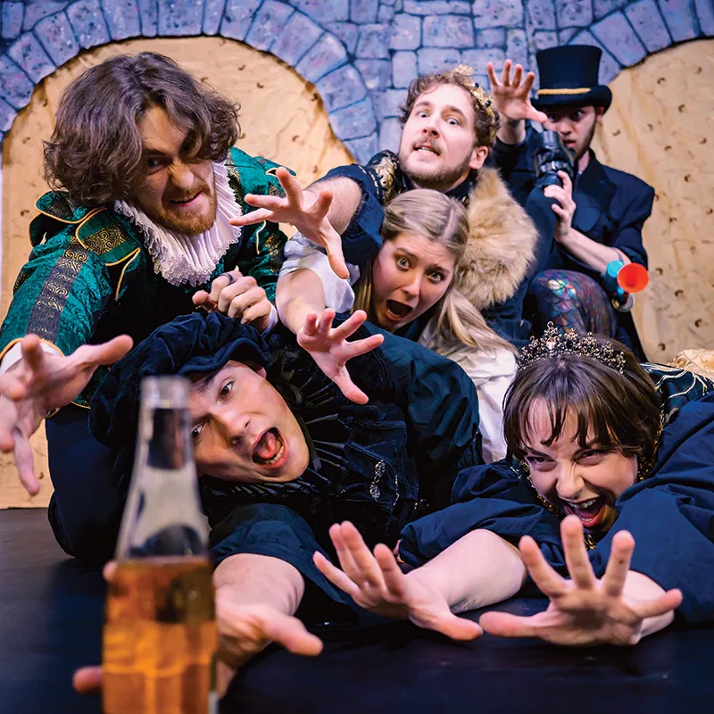 6 characters from Hamlet enthusiastically and desperately reaching toward one beer bottle.