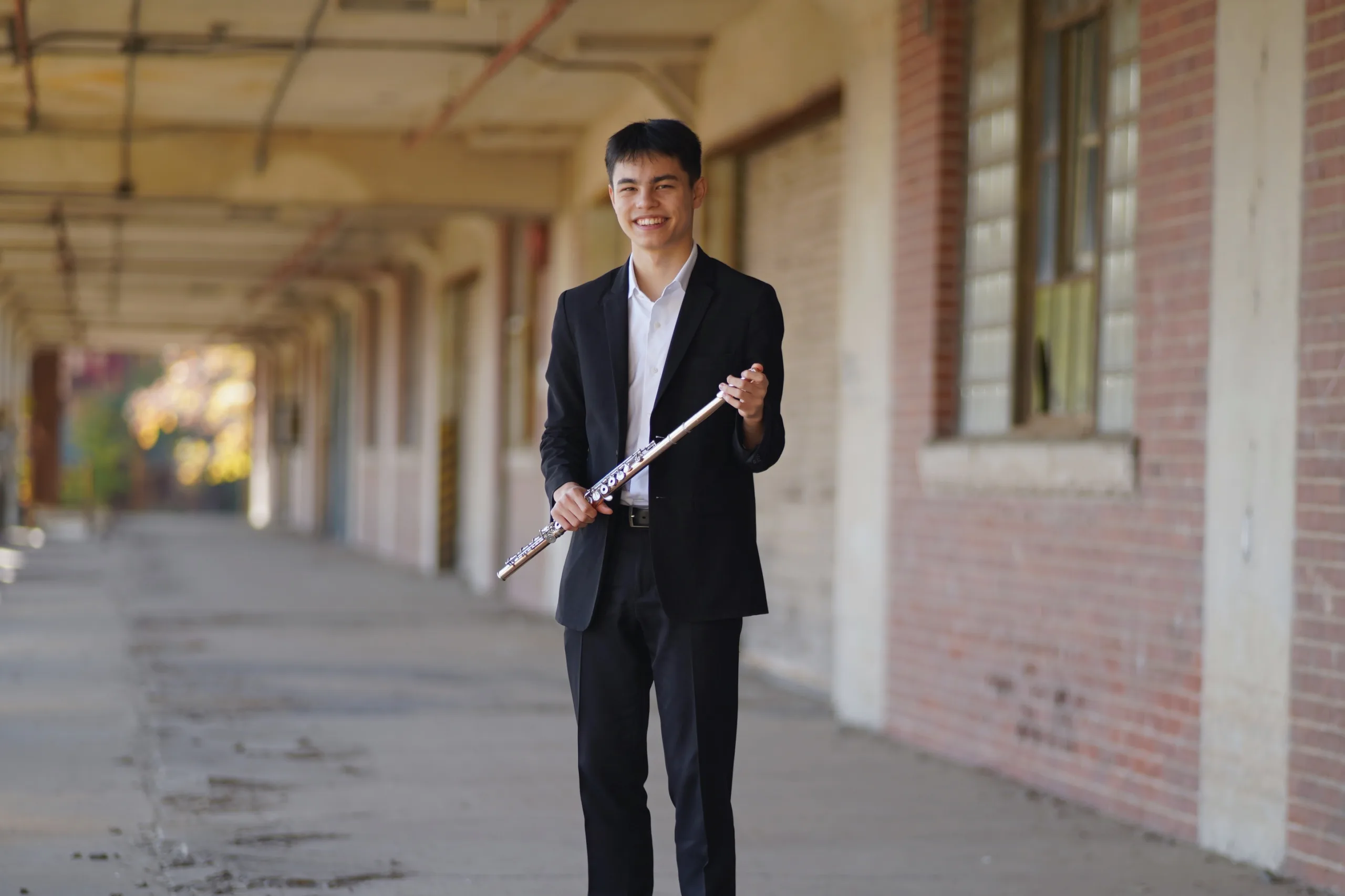 Julin Cheung holding flute