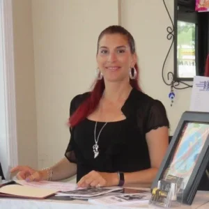 Woman sitting at a desk smiling