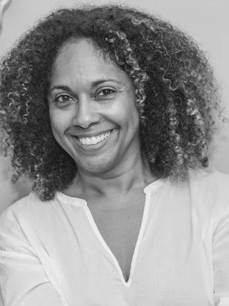 Cathleen Dean smiling black and white headshot.