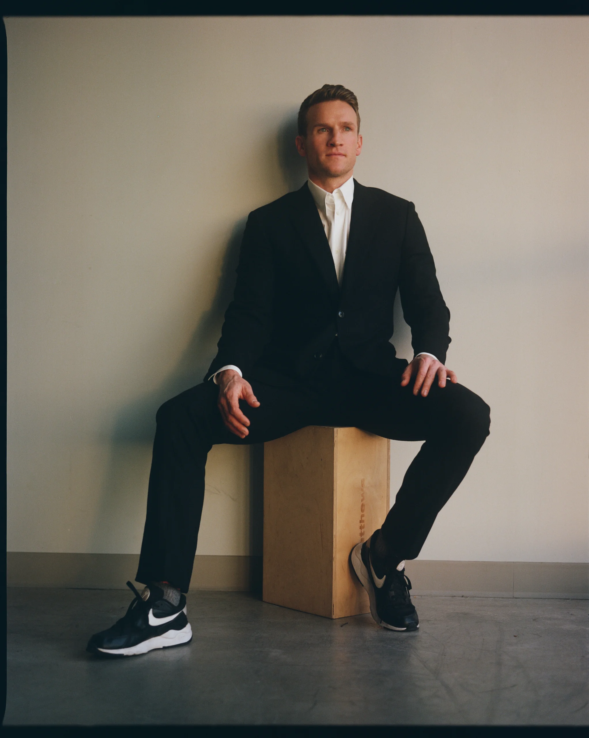 Claybourne Elder poses on wooden block.