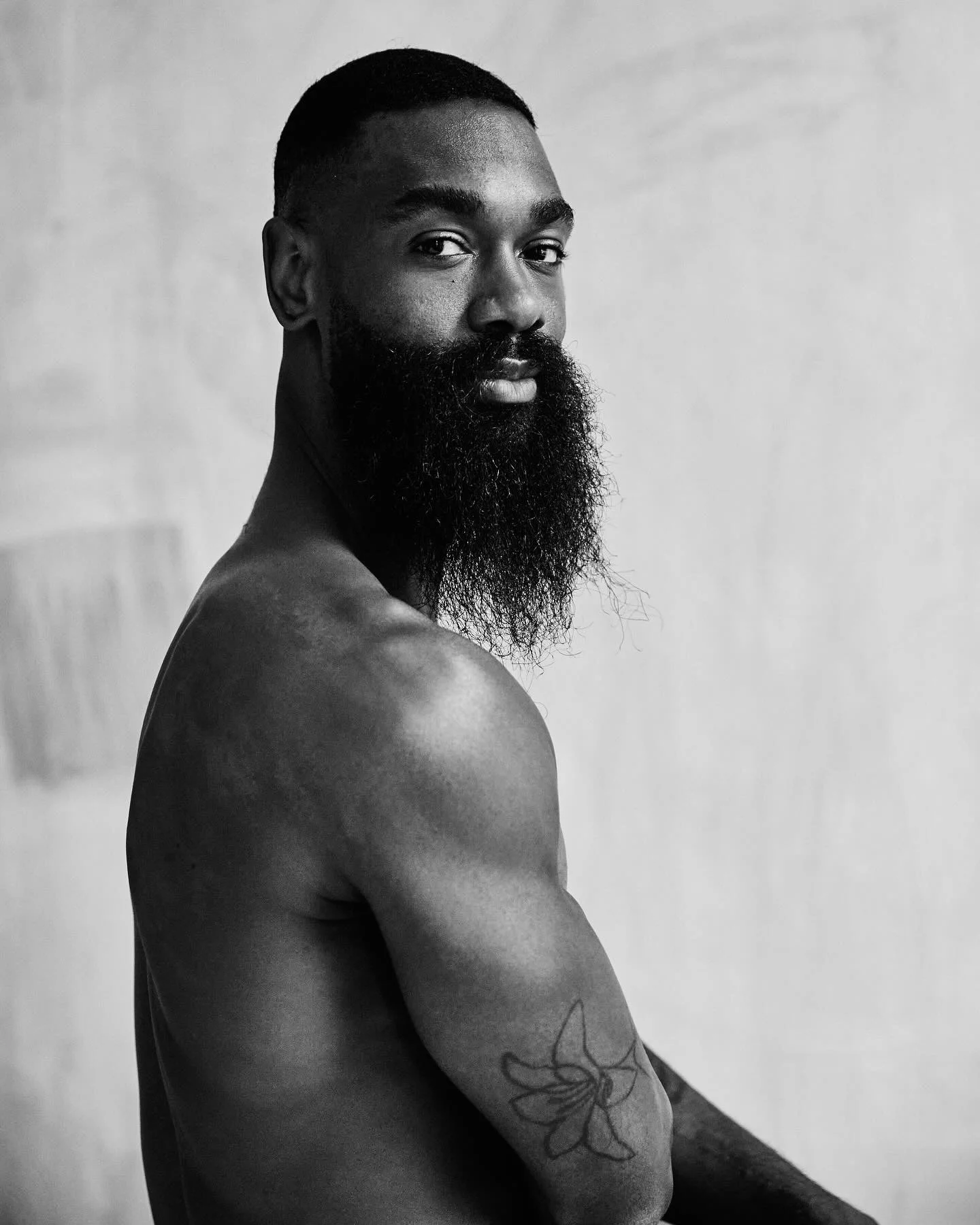 Gentry Isaiah George with a long beard black and white headshot.