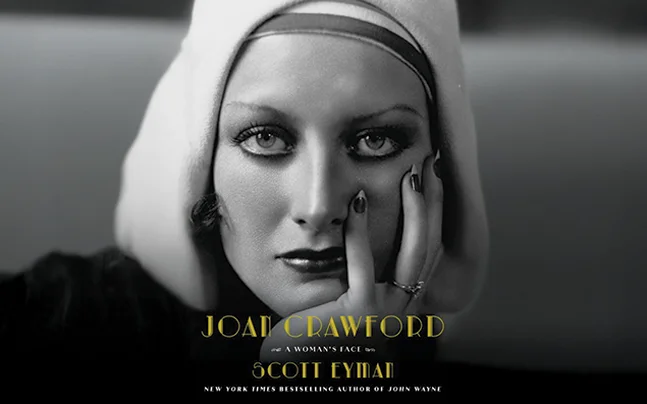 Book cover of 'Joan Crawford: A Woman's Face' by Scott Eyman, featuring the subtitle 'New York Times Bestselling Author of John Wayne.