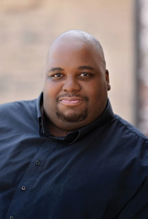 Limmie Pulliam headshot, wearing blue shirt.
