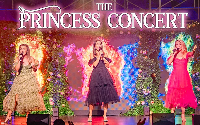 Text reads The Princess Concert. Three women on stage singing wearing different color dresses.