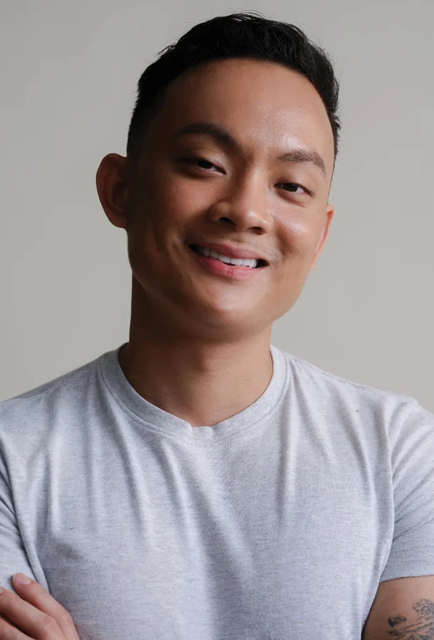 Headshot of Nurse John in a white shirt