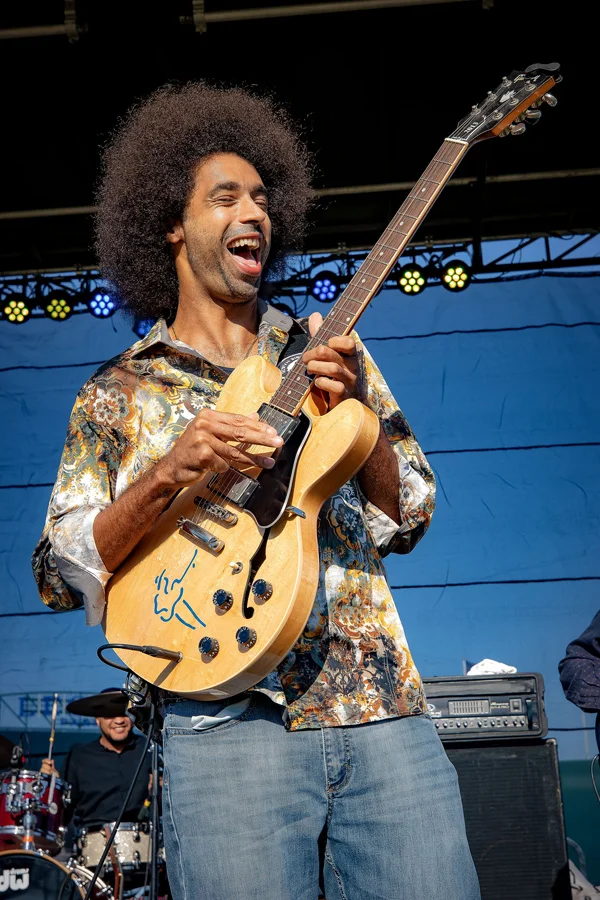 Selwyn Birchwood playing guitar