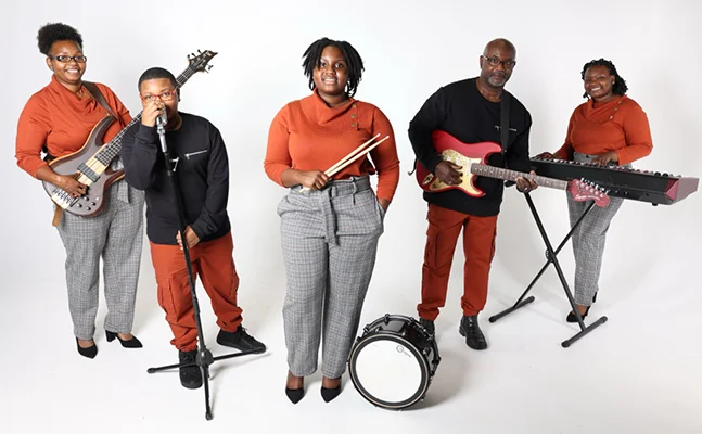 The Zeigler Family in studio with instruments.