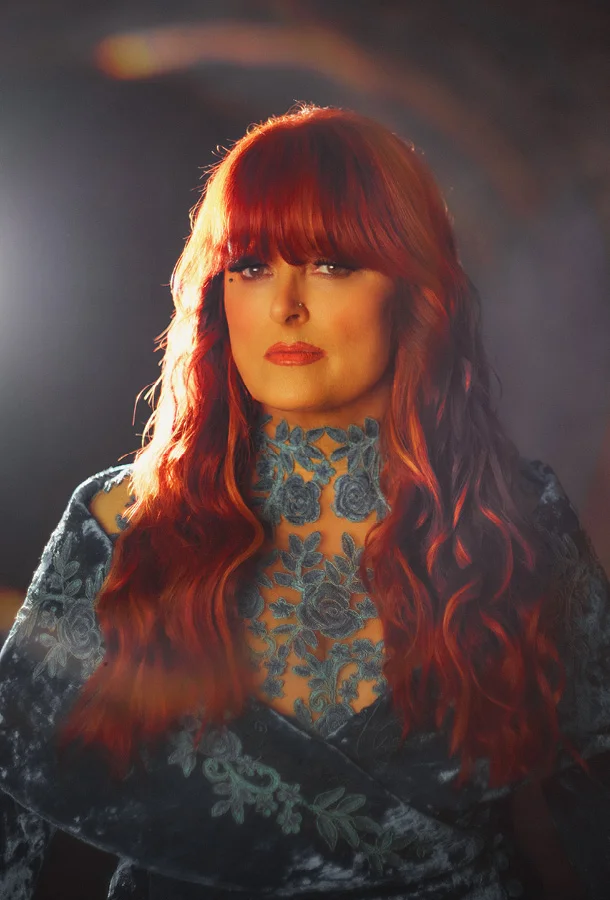 Wynonna Judd in blue dress portrait
