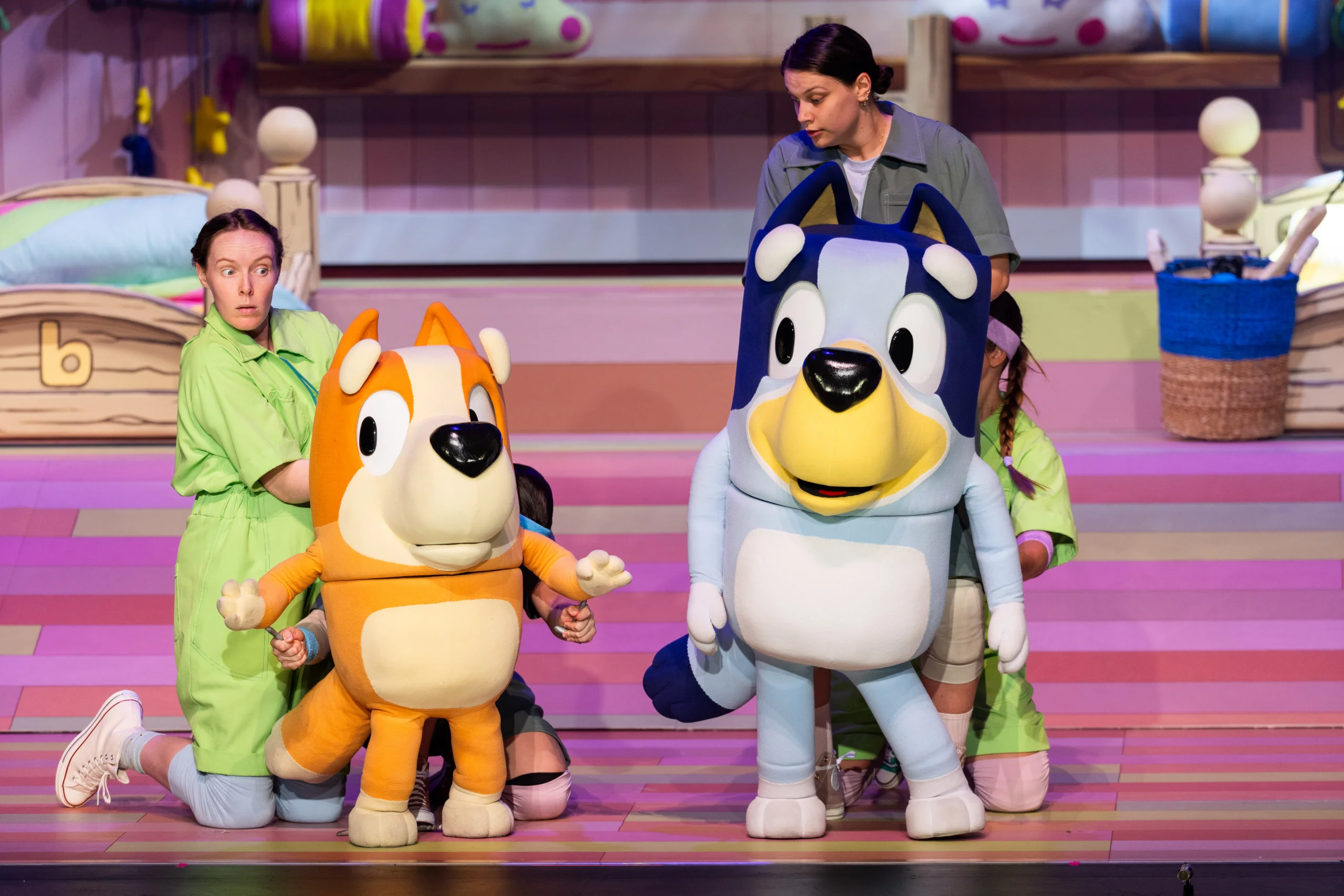 Bluey and Bingo character puppets onstage during Bluey’s Big Play.