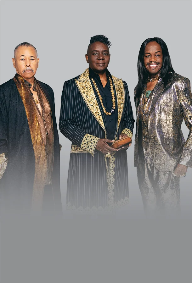 Three musicians in ornate gold and black performance attire posed for a promotional portrait.