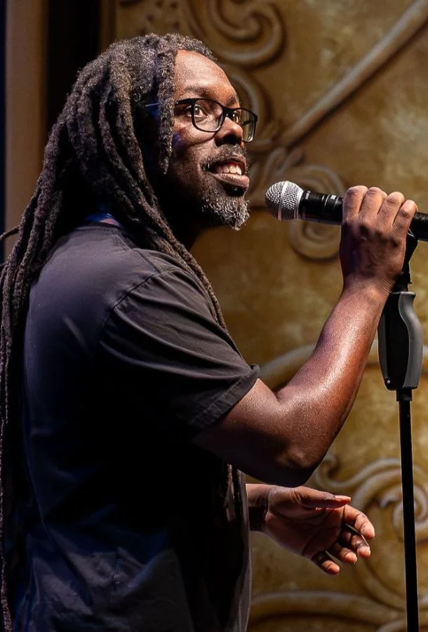 OMGitsWicks performs with a microphone.