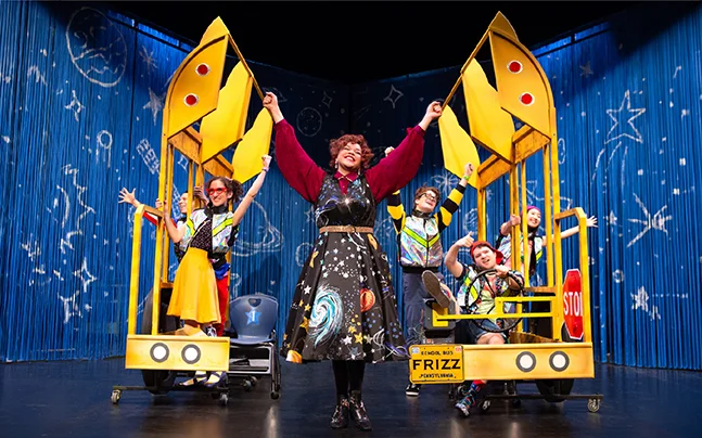 Five performers ride the yellow Magic School Bus during a live stage production inspired by the popular children's book series.