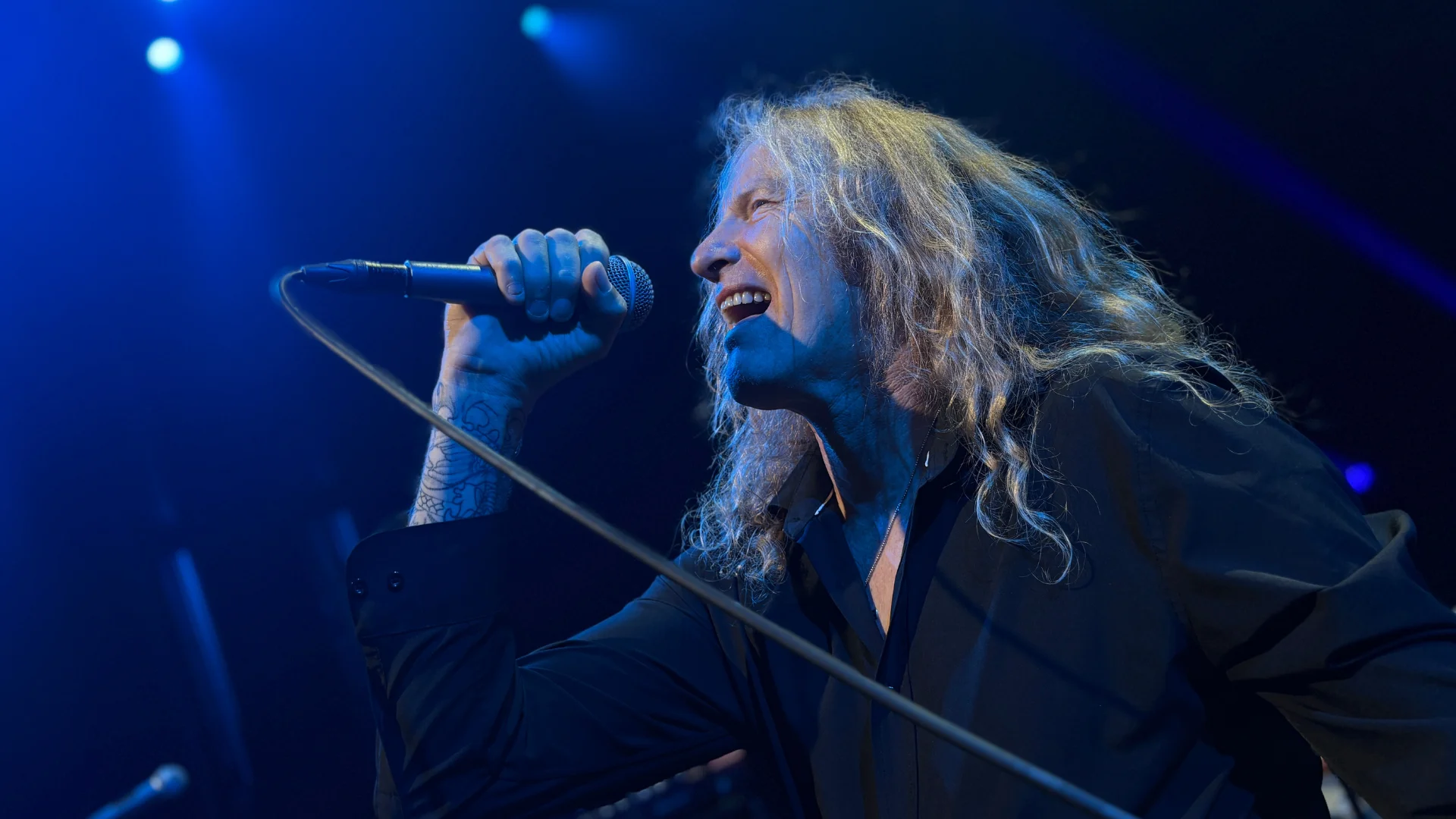 Closeup photo of singer on stage.