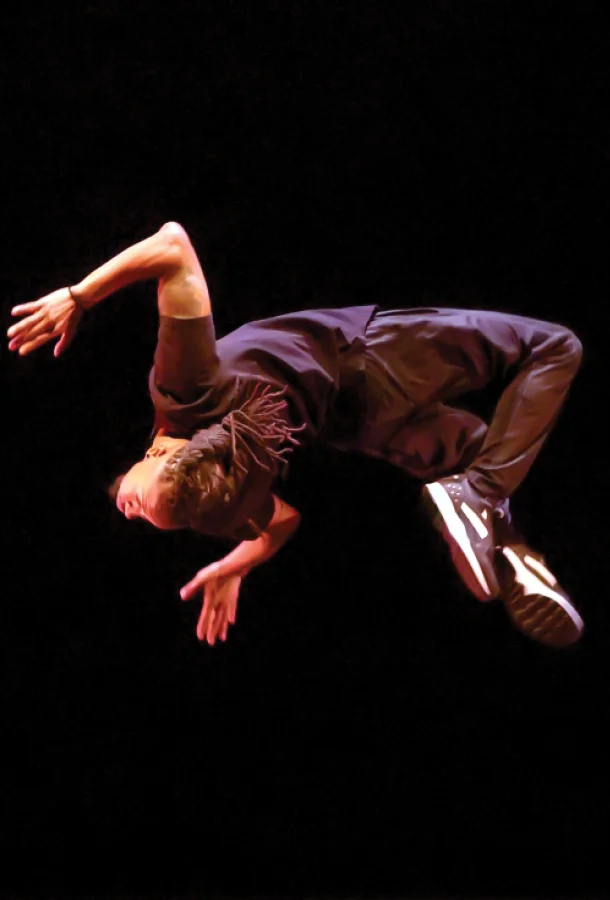 Dancer do backflip in the air.