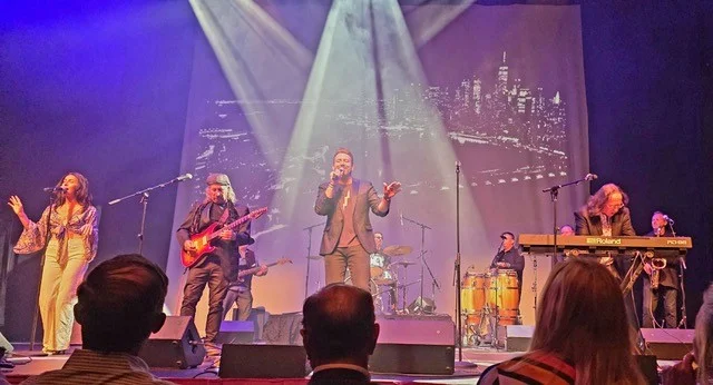 The Expanding Man Band performing on the stage in the Rinker Playhouse.